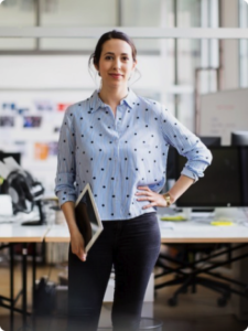 Woman standing with tablet device